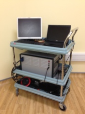 The combined DOI-EEG system is portable on a trolley and can be moved to the cot-side for infant scanning